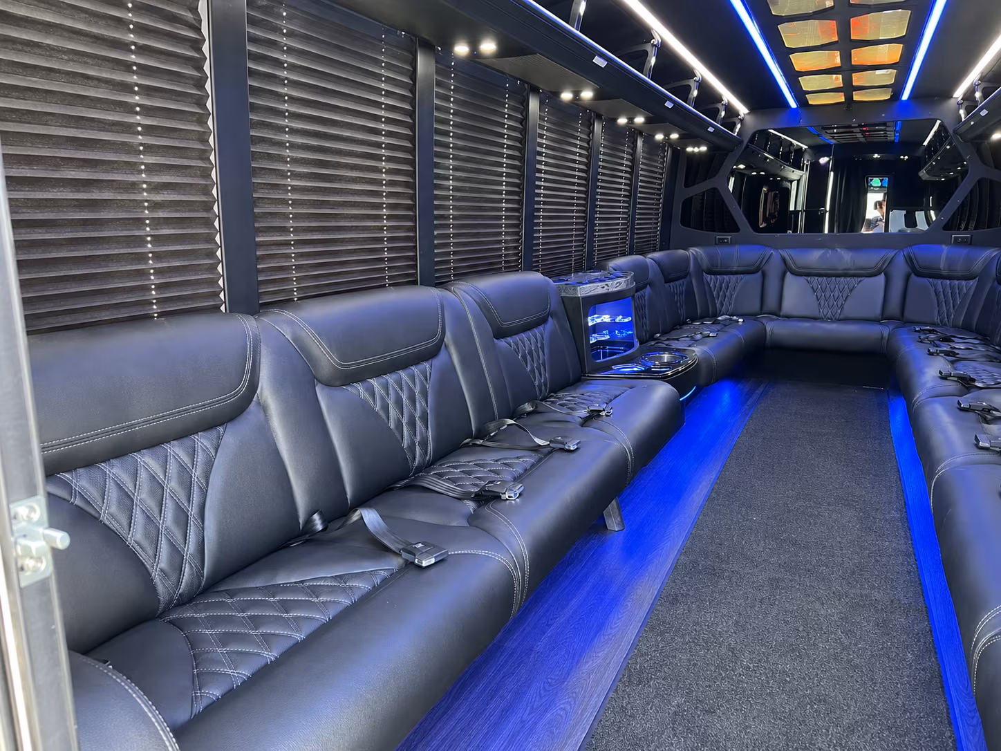Friends laughing during a party bus celebration in Round Rock
